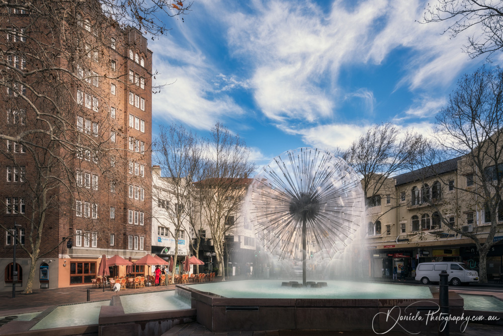 Memorial Fountain El Alamein on Urban Street Background